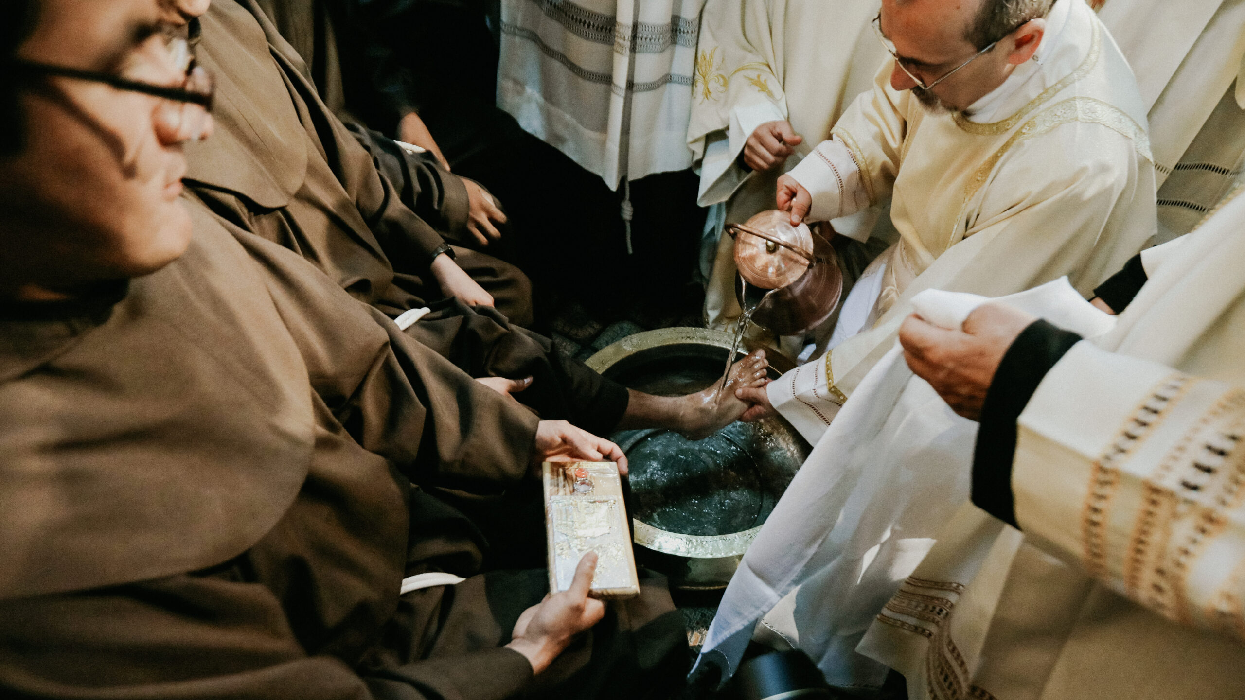 Priests gathered around the washing of the feet