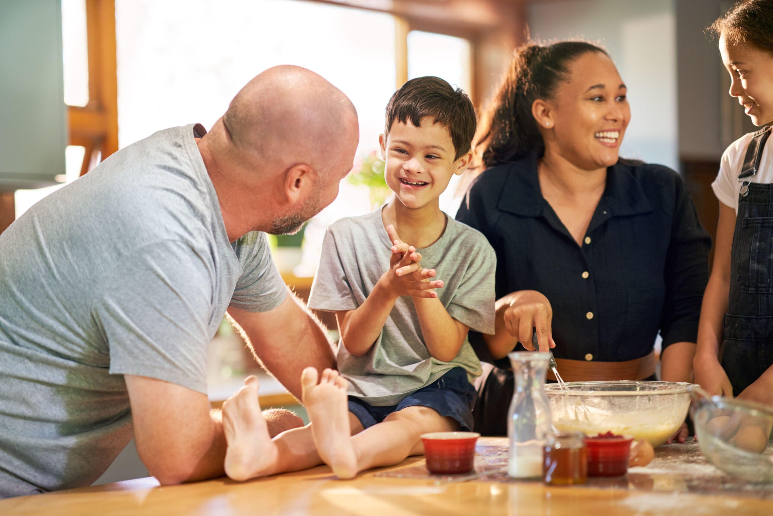 Family with happy boy with Down syndrome