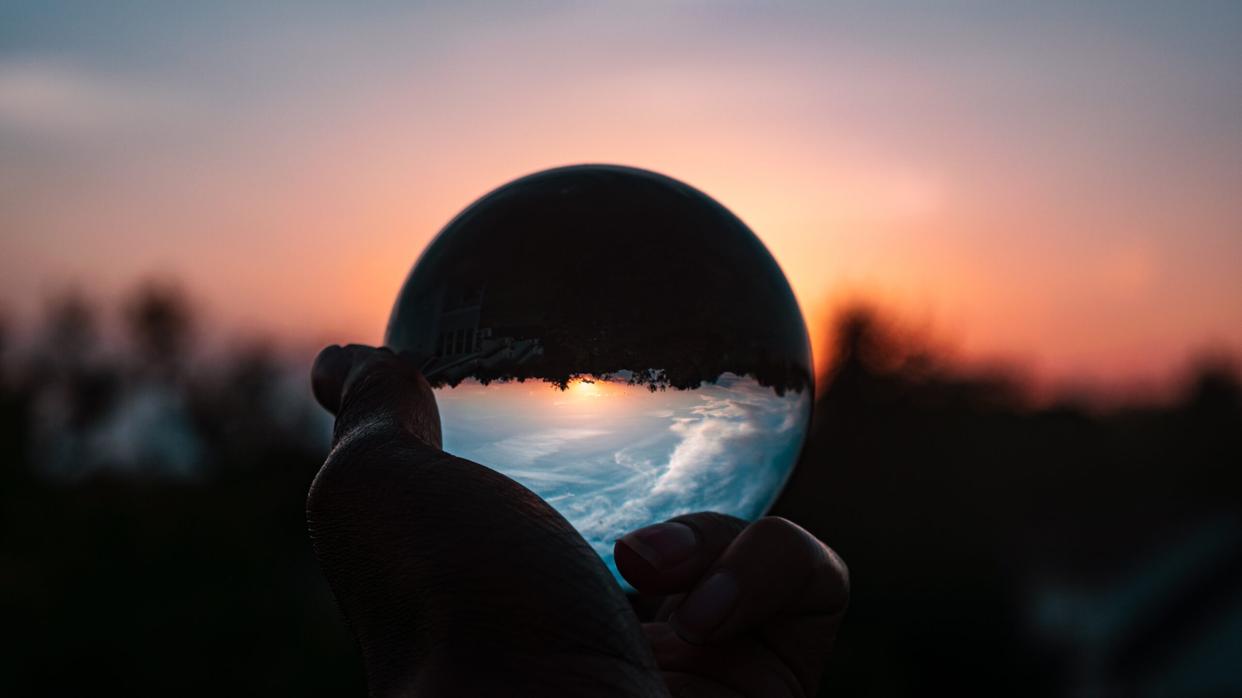 a radiating globe in a hand