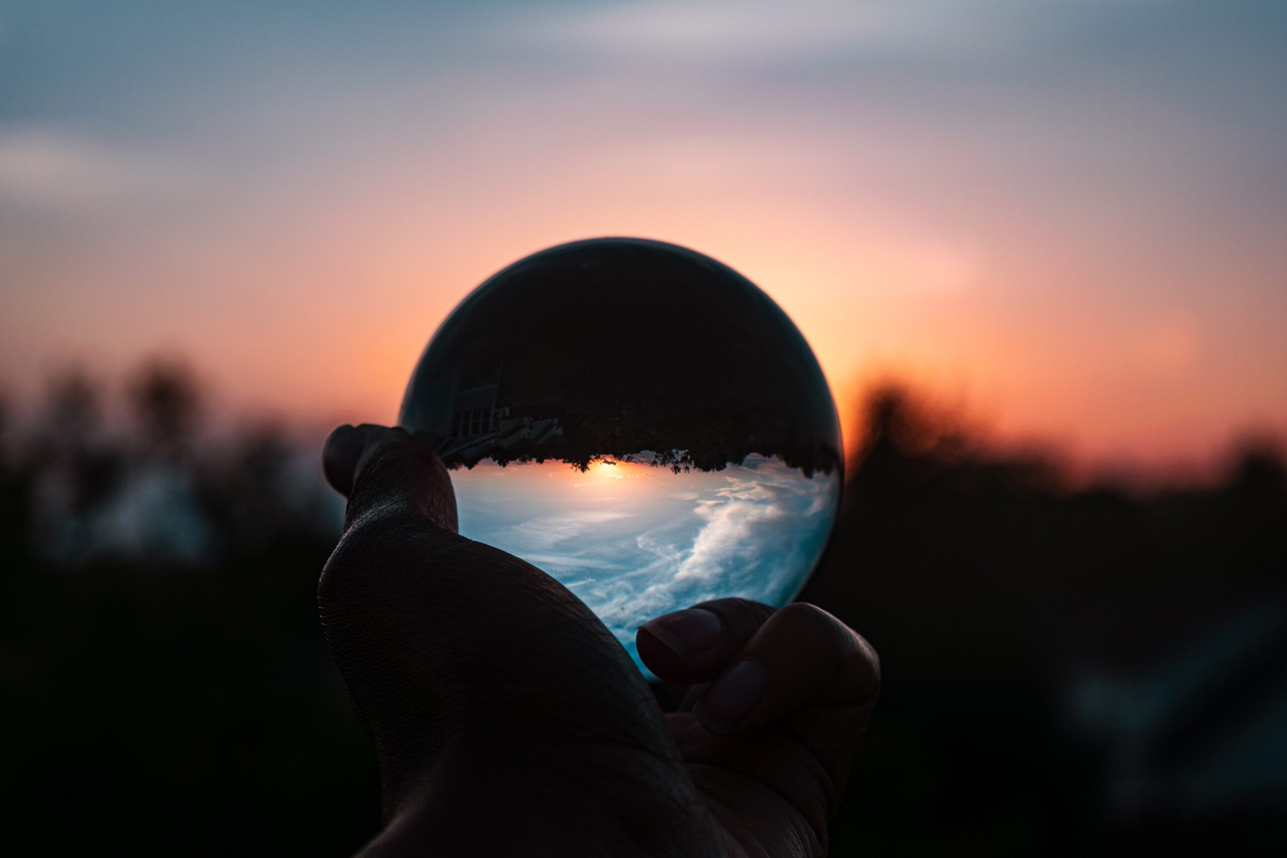 a radiating globe in a hand