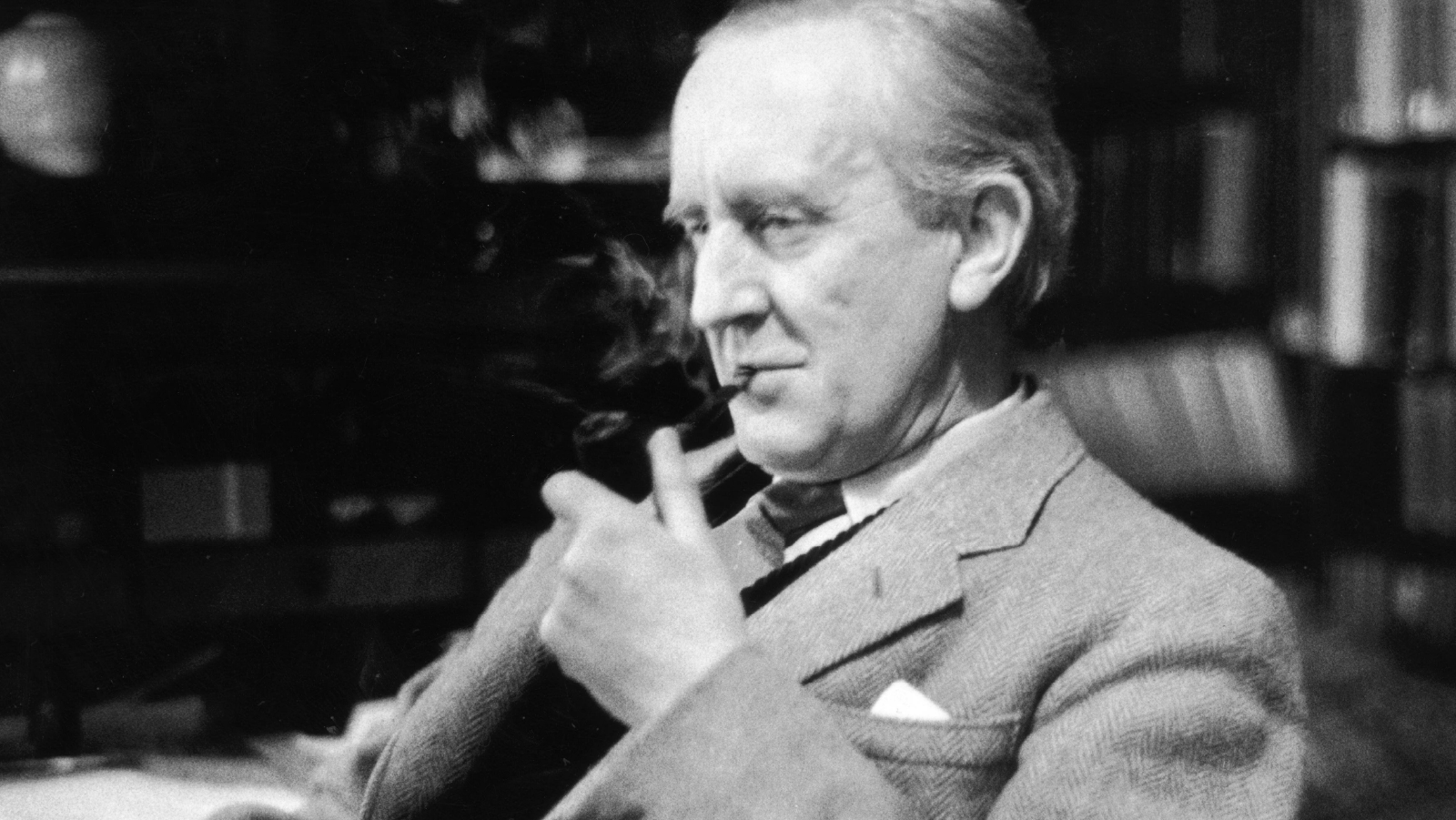 Tolkien sitting and smoking a pipe