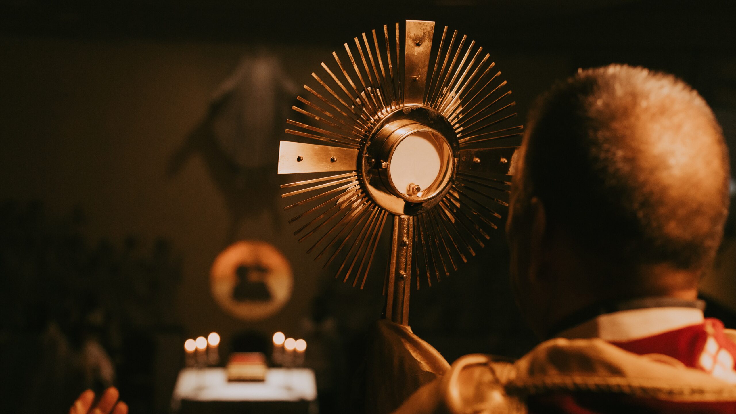 monstrance in front of priest