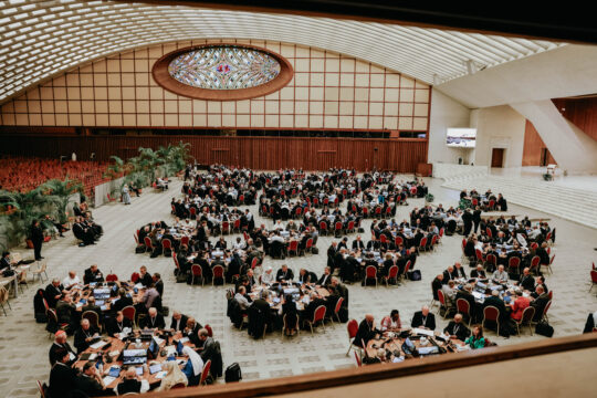 assembly of people at tables in ballroom