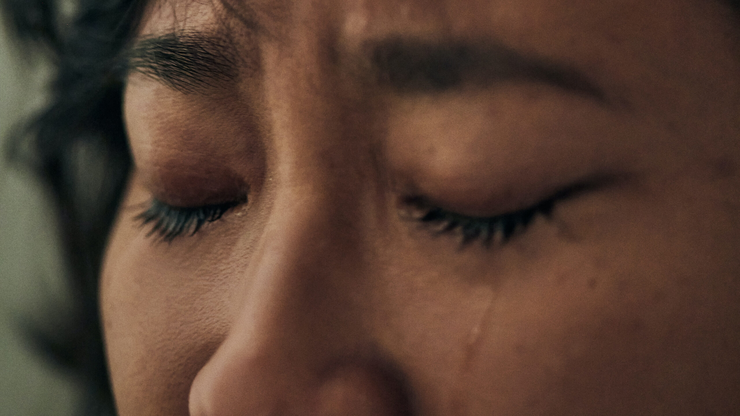 closeup of woman's face eyes crying
