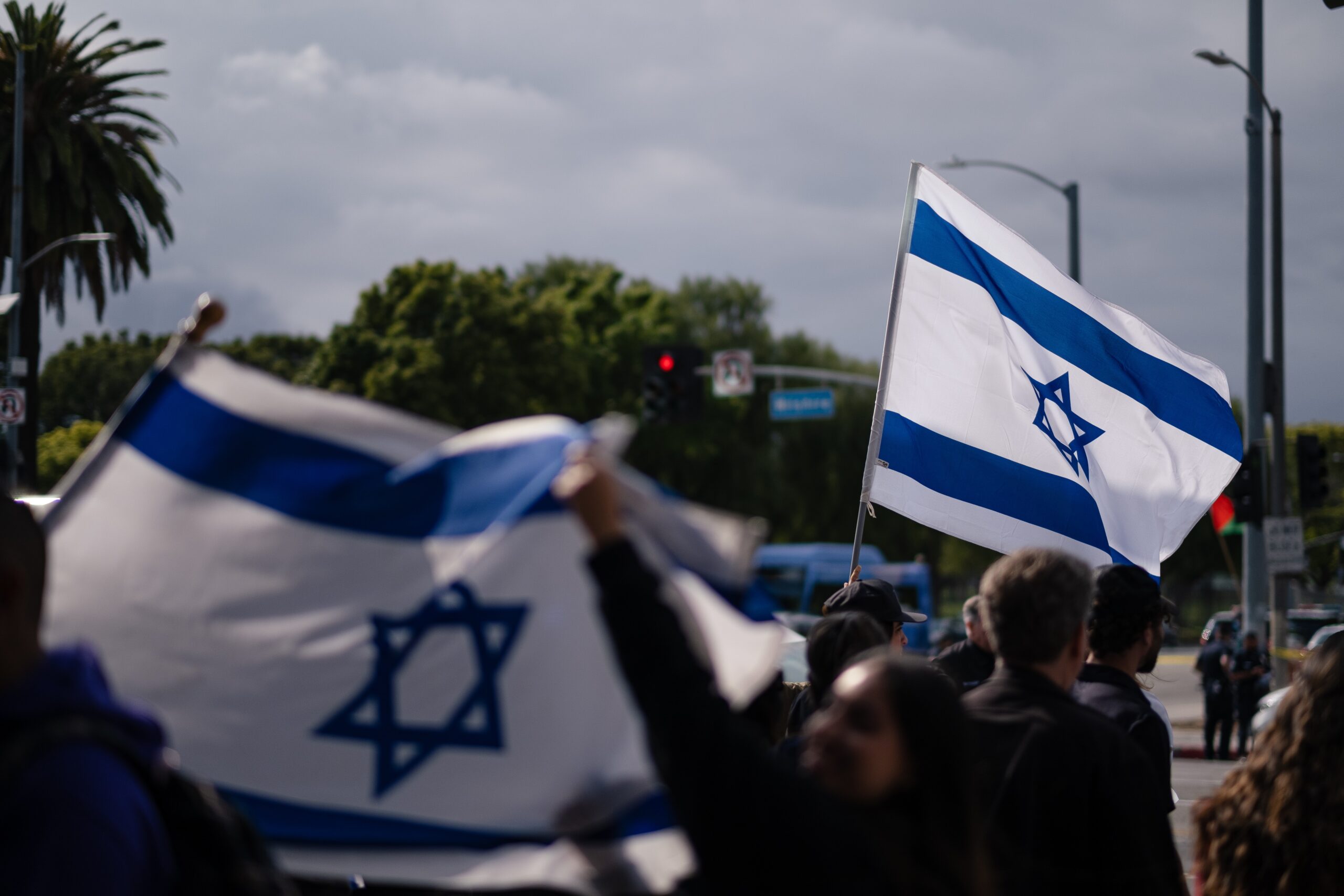 israeli flags waved in a crowd