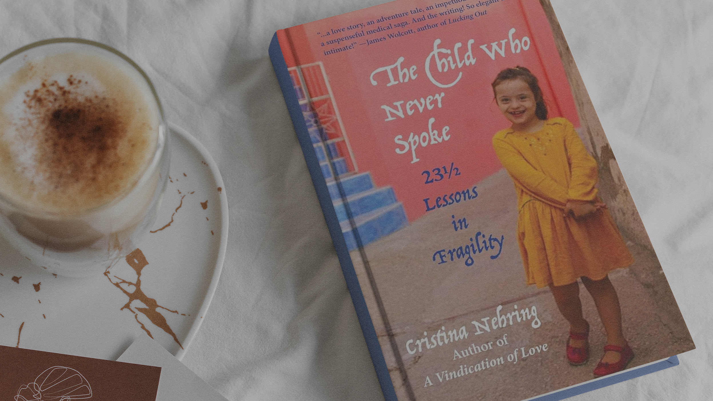 book The Child Who Never Spoke lying on a table with coffee