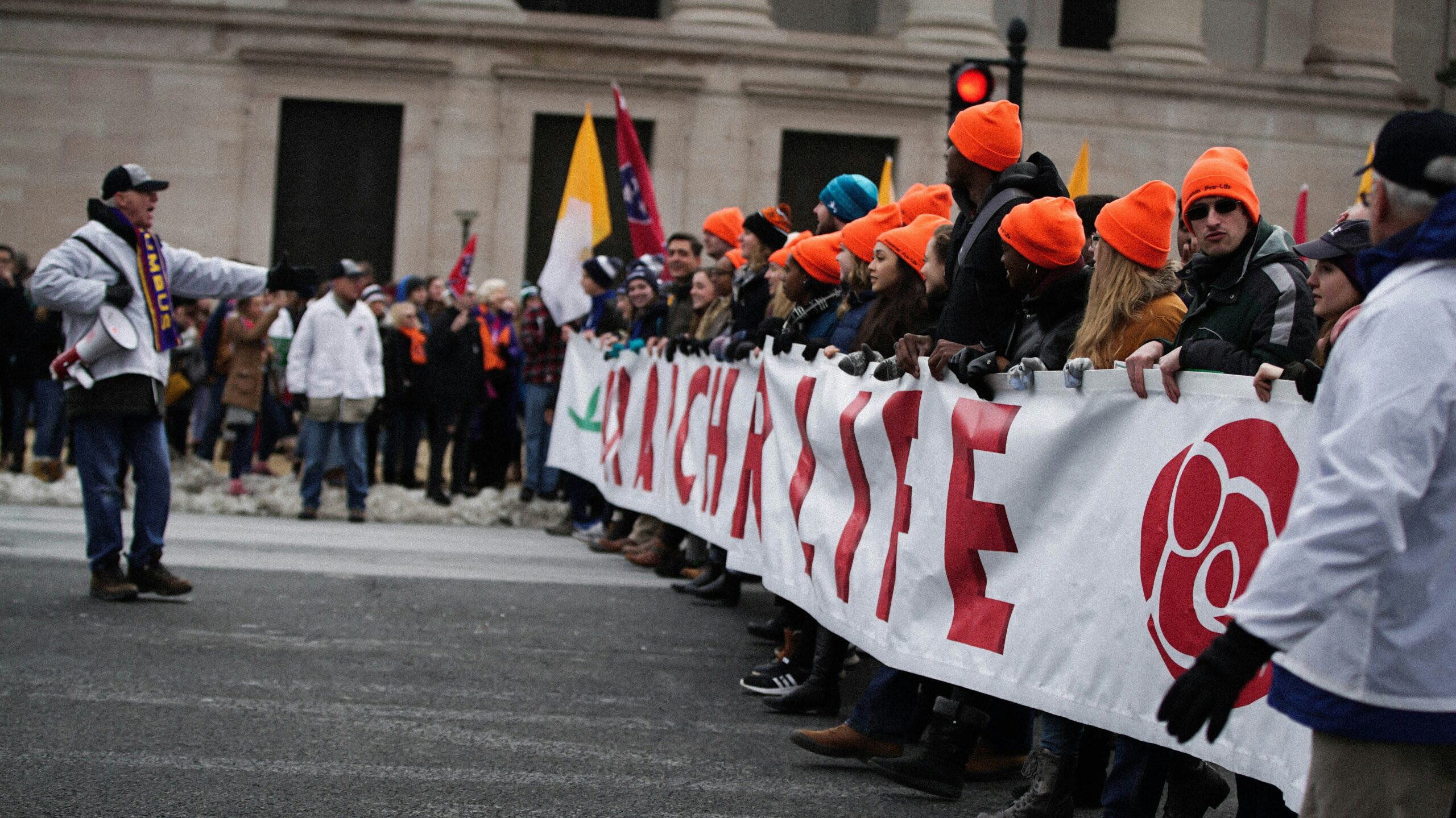 Pro-lifers standing together with a banner