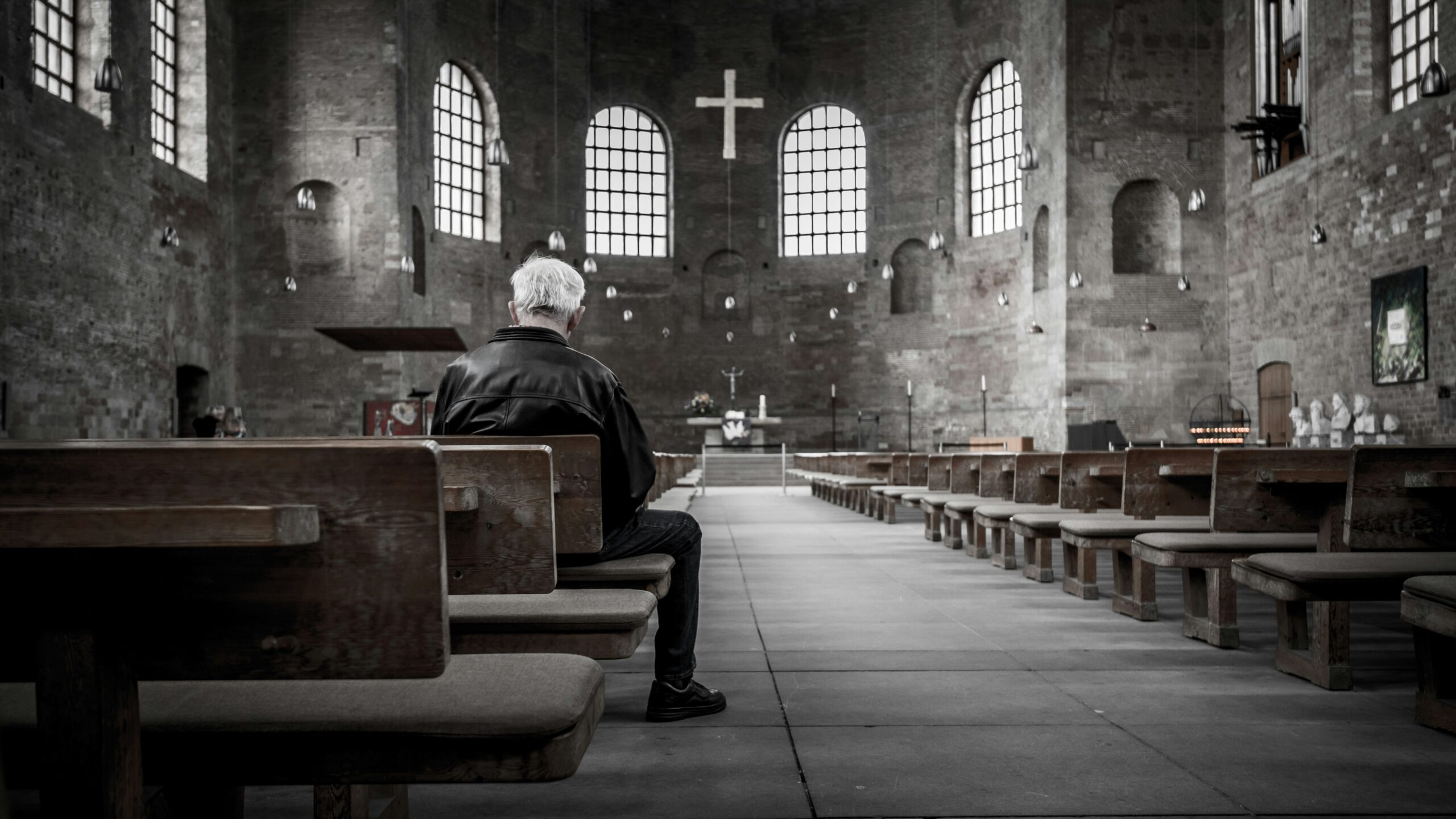 Man sitting in an empty church