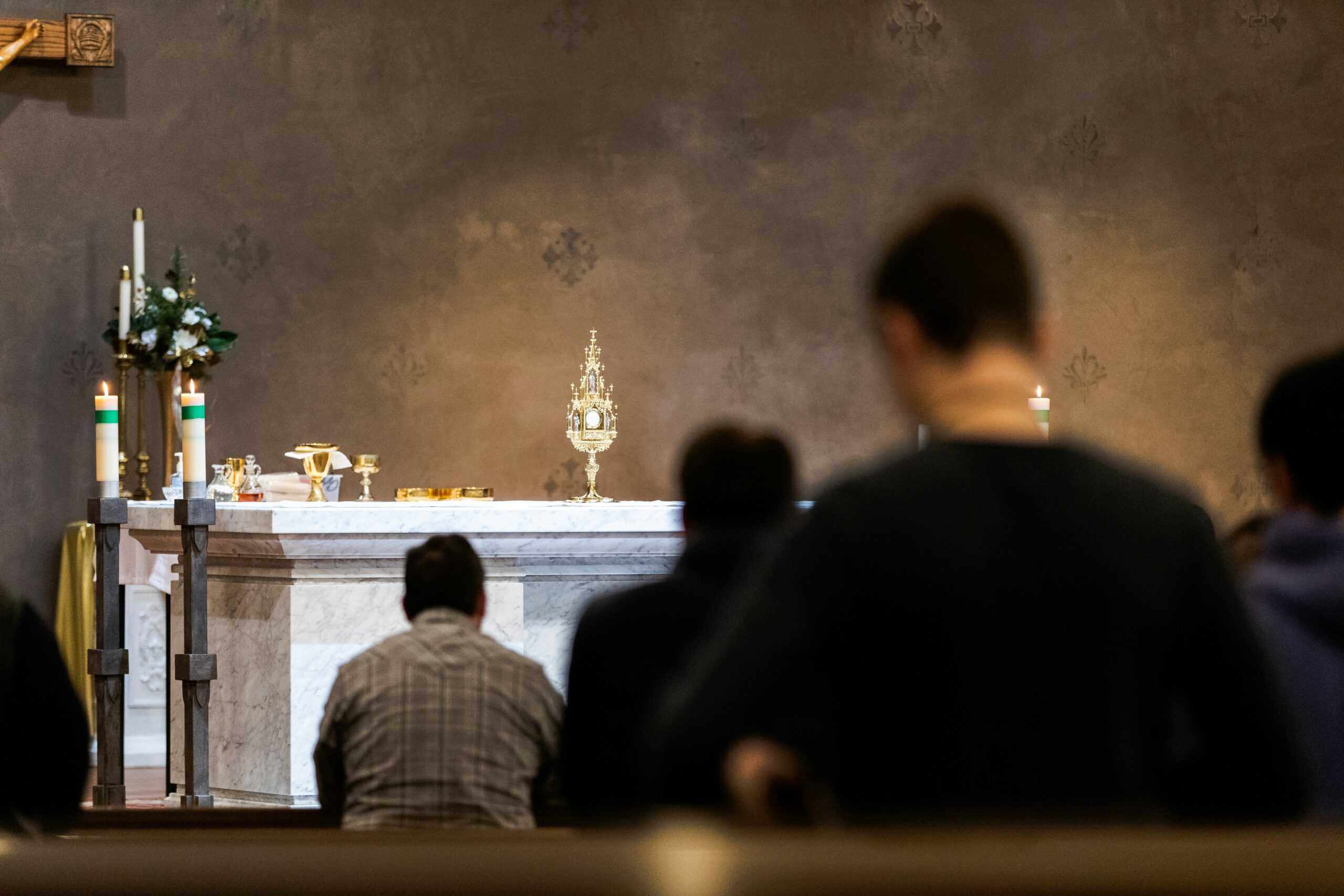 people in front of the Blessed Sacrament