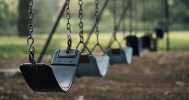 empty swings on playground