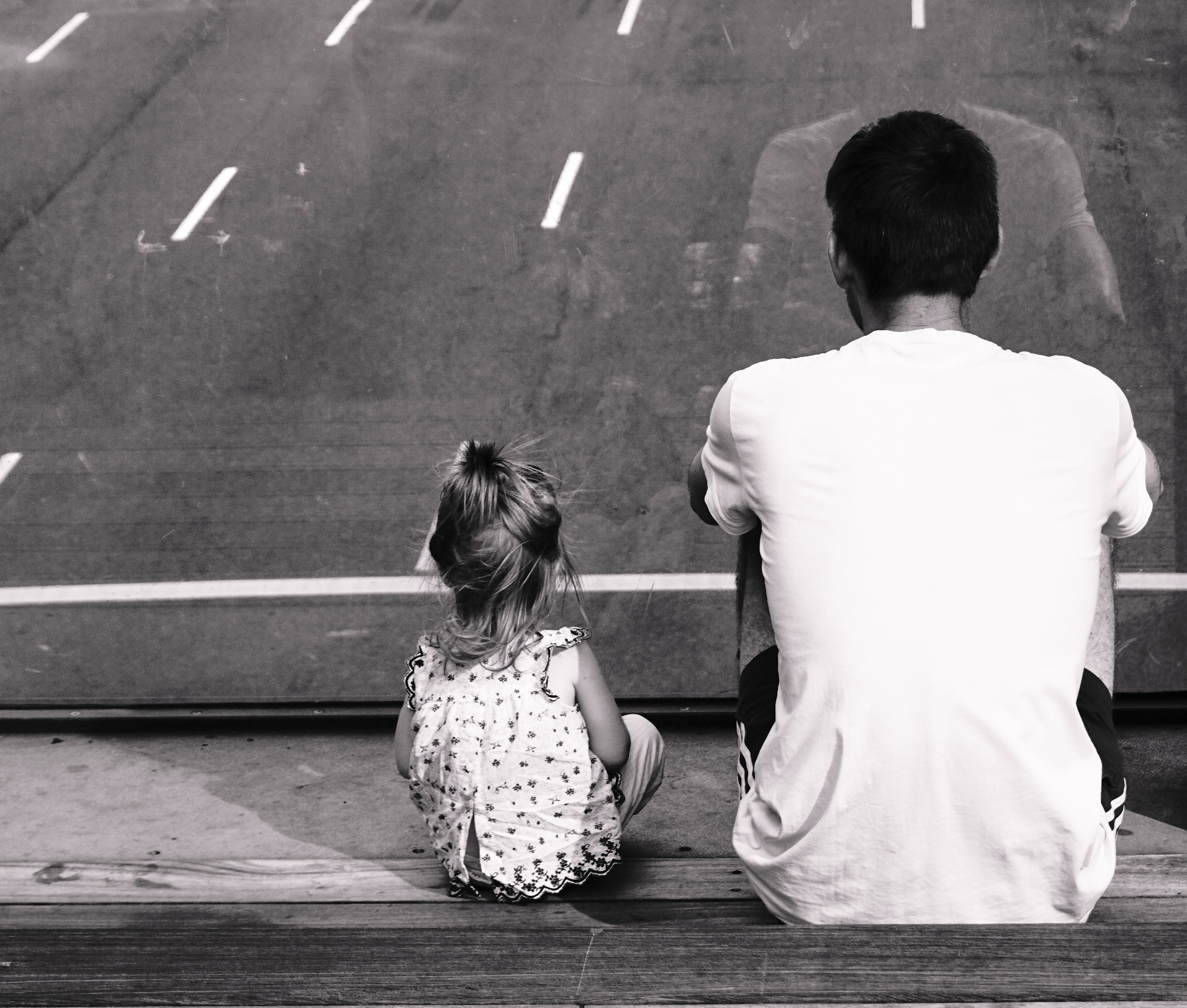 a father sitting with his daughter