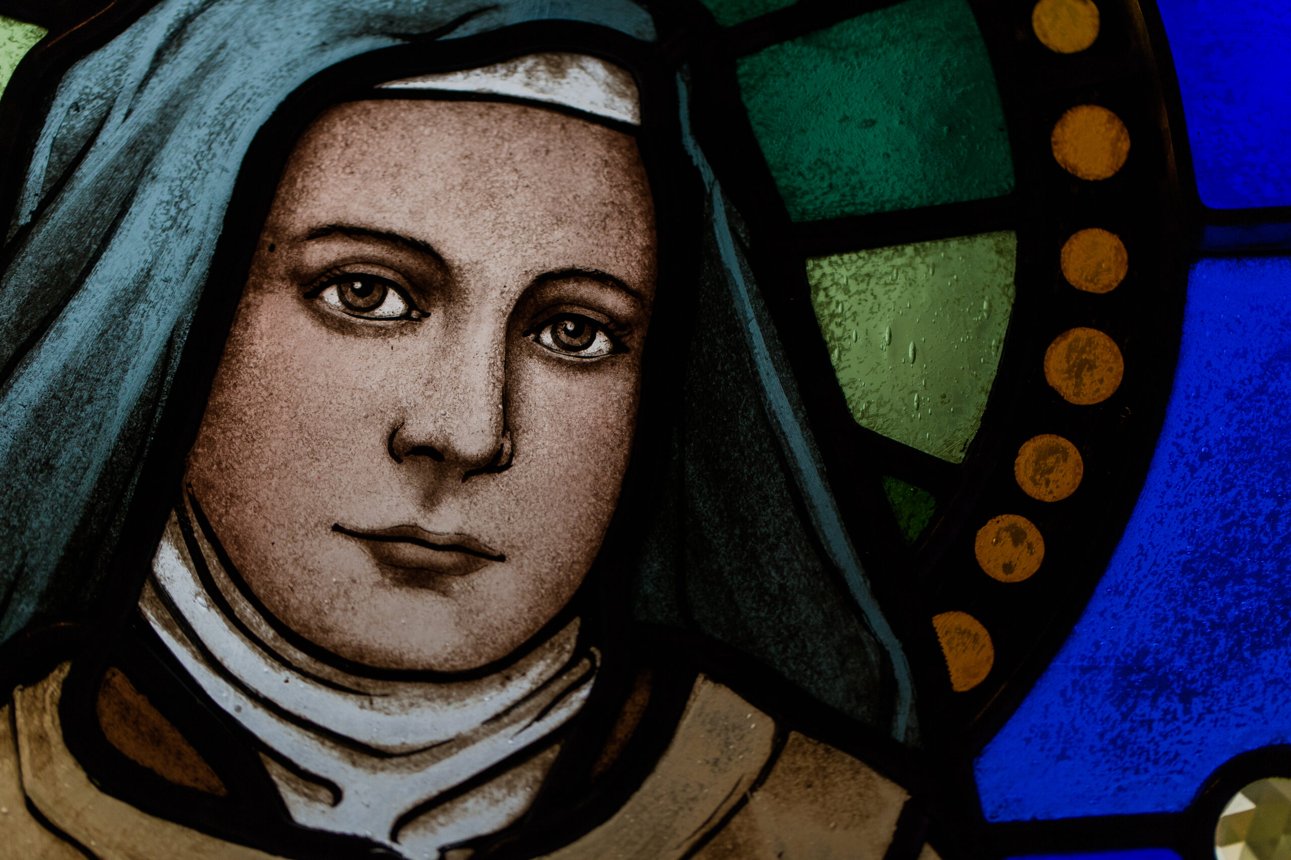 Stained glass image of St. Therese