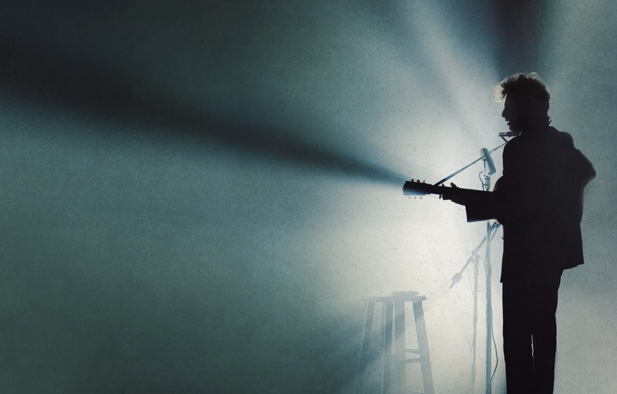 Silhouette of Bob Dylan on stage