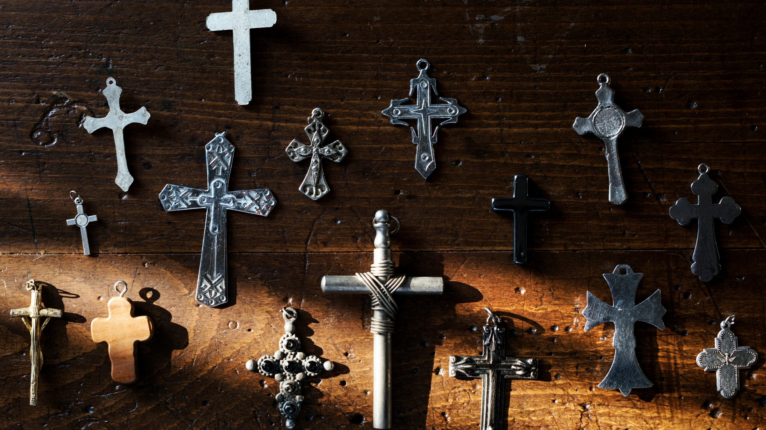 Crucifixes spread around a table top