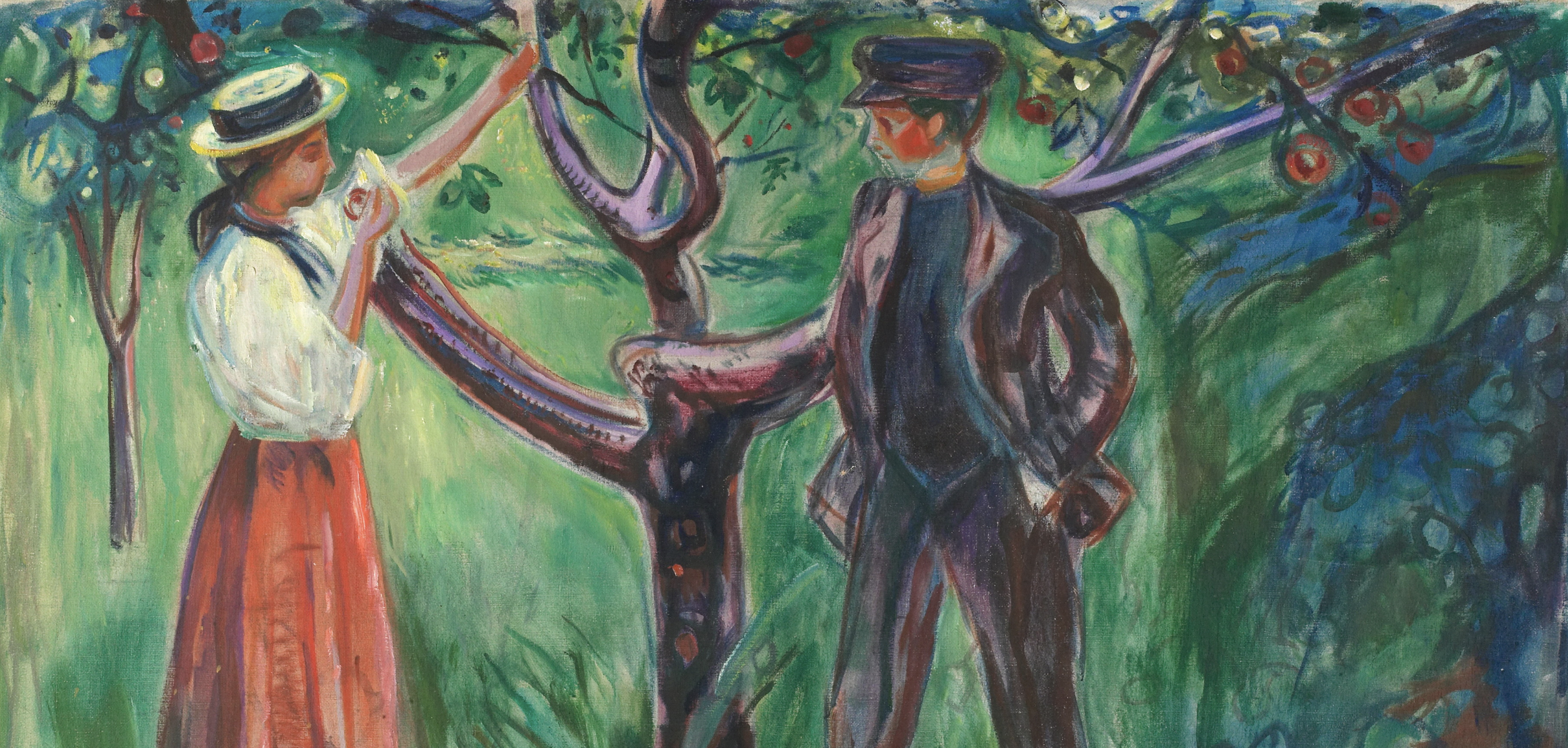 man and woman standing under tree