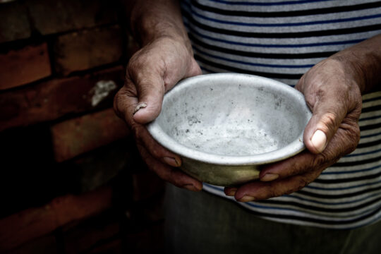 hands holding an empty bowl