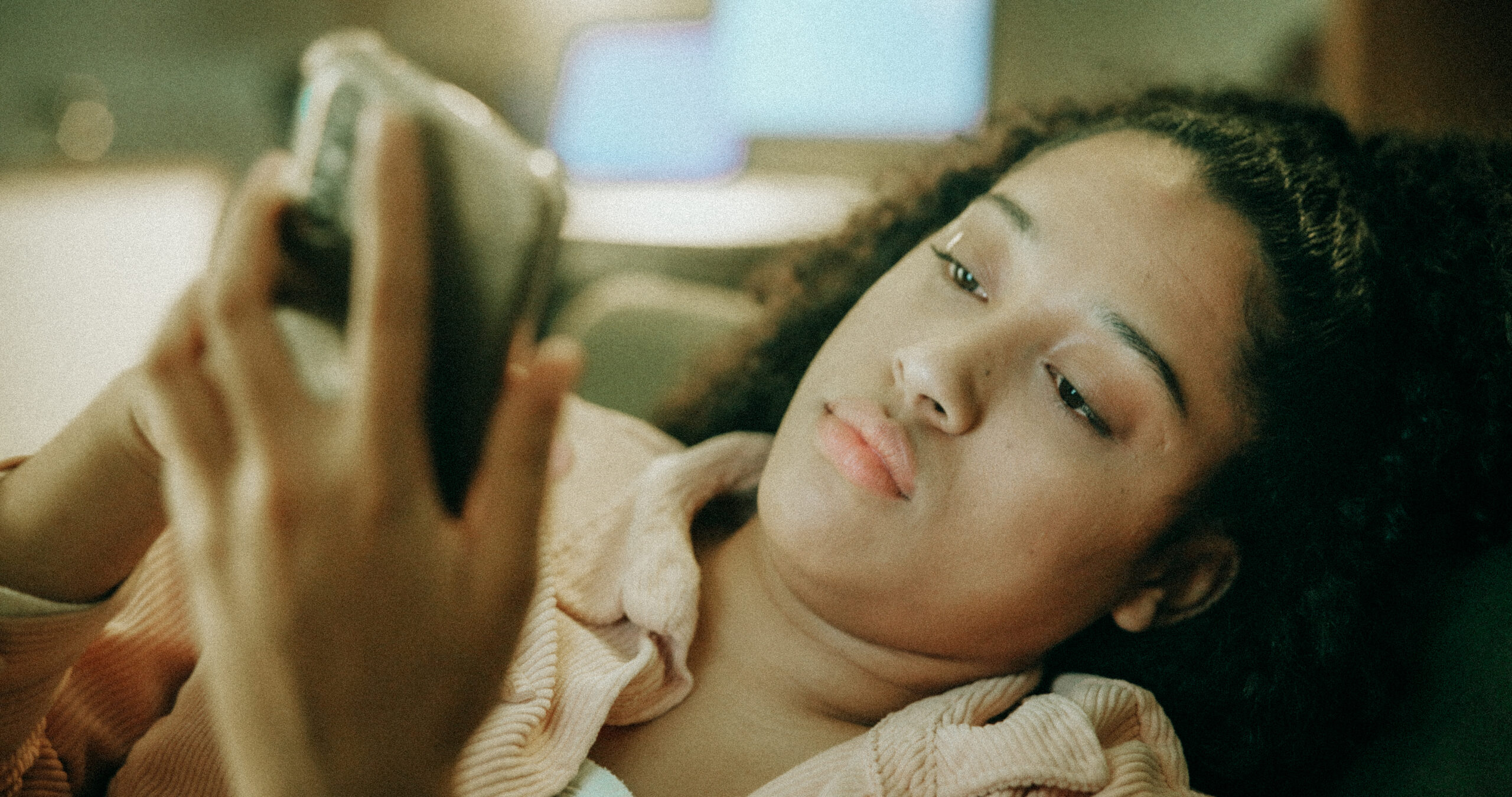 woman looking at phone