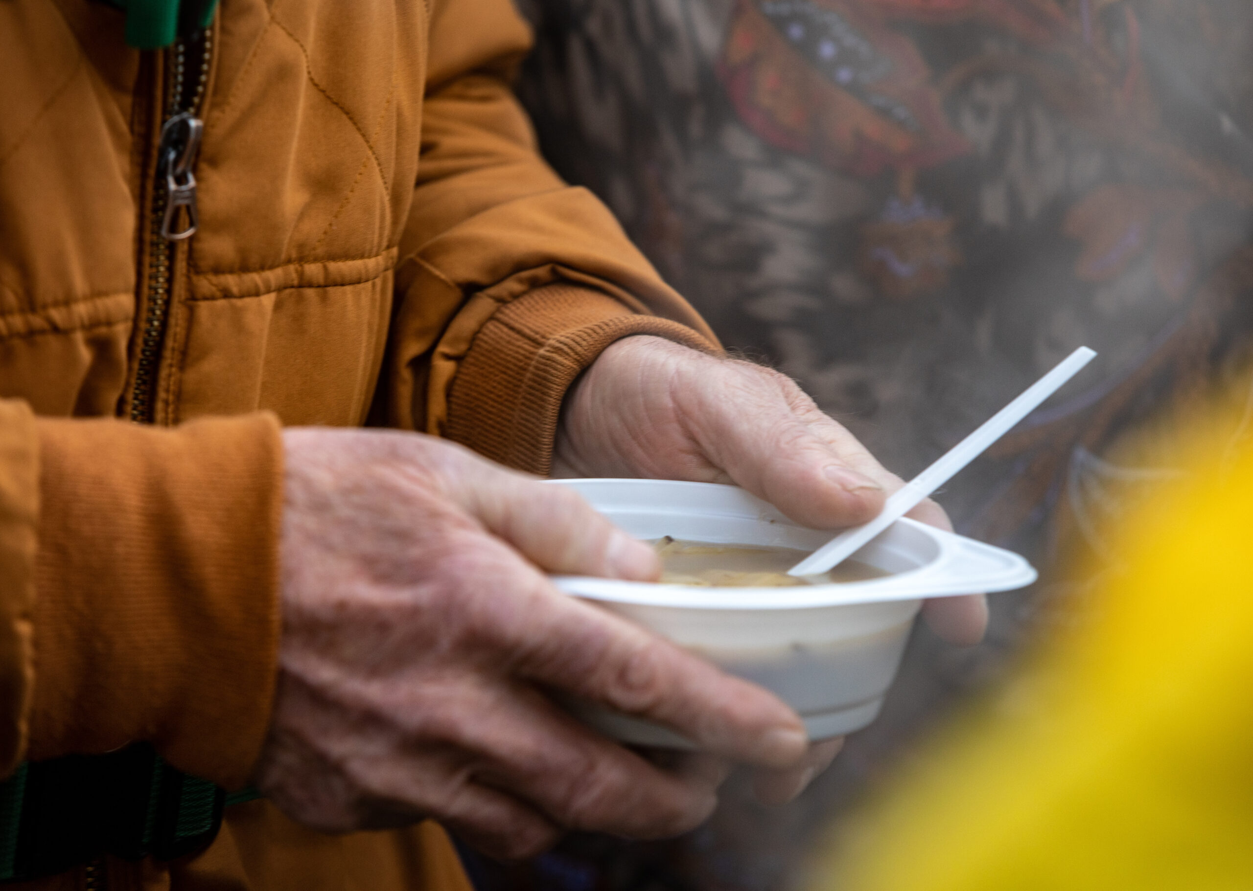 man's hands holding bowl