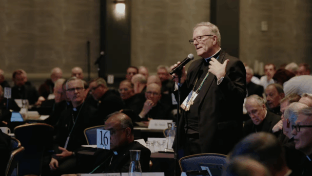 man standing with microphone