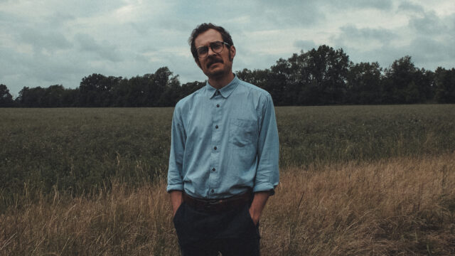 man standing in field