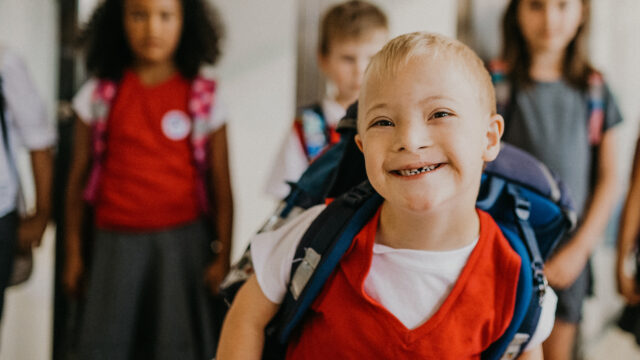 kid smiling red shirt