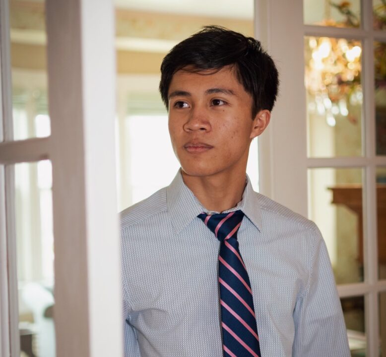 man looking out door