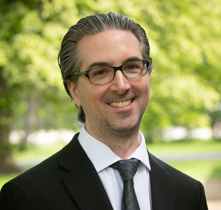 man smiling with suit