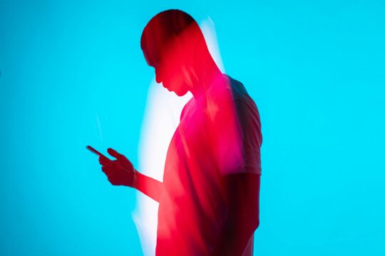 person staring at phone