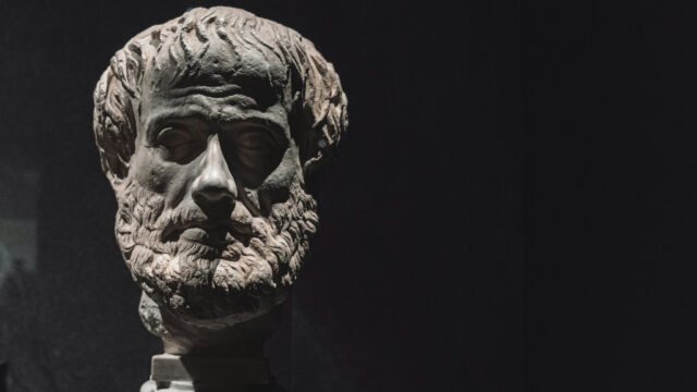 white statute on black background