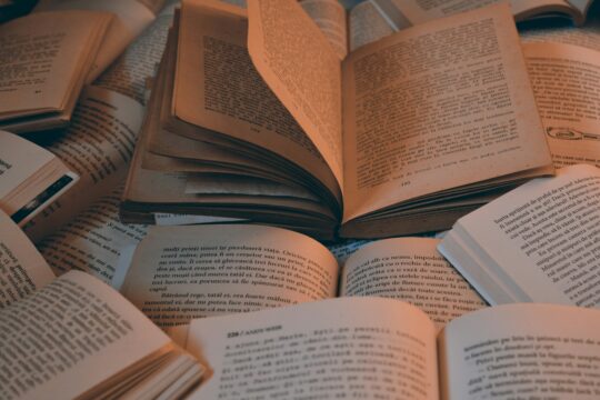 a pile of open books