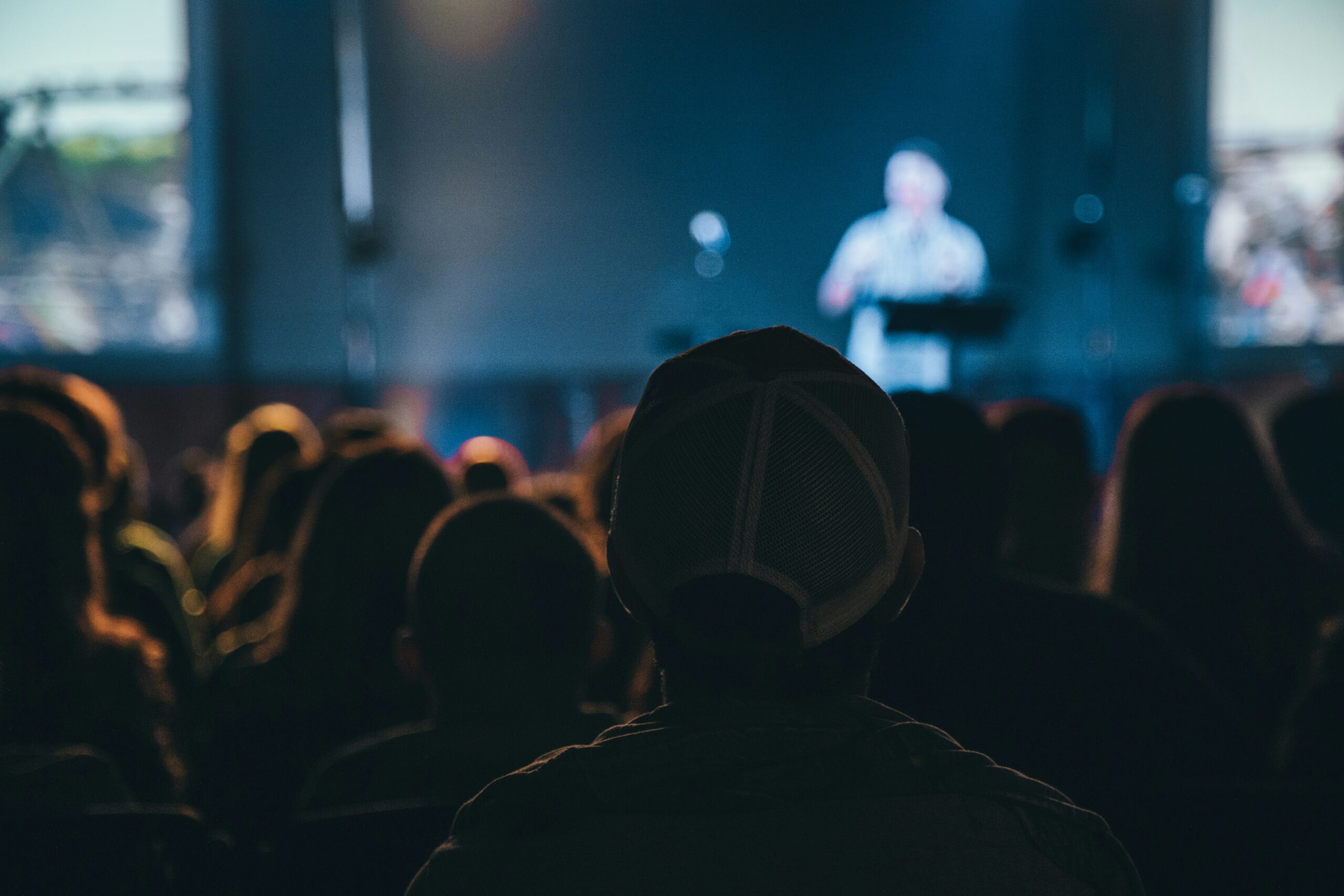 audience member silhouette in conference crowd