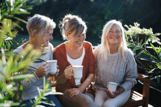 women sitting together laughing