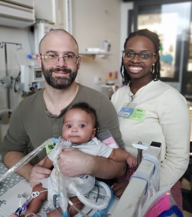 Cassian and parents smiling