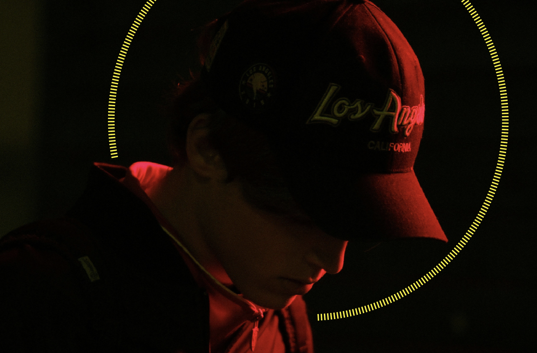 Young man with hat looking down